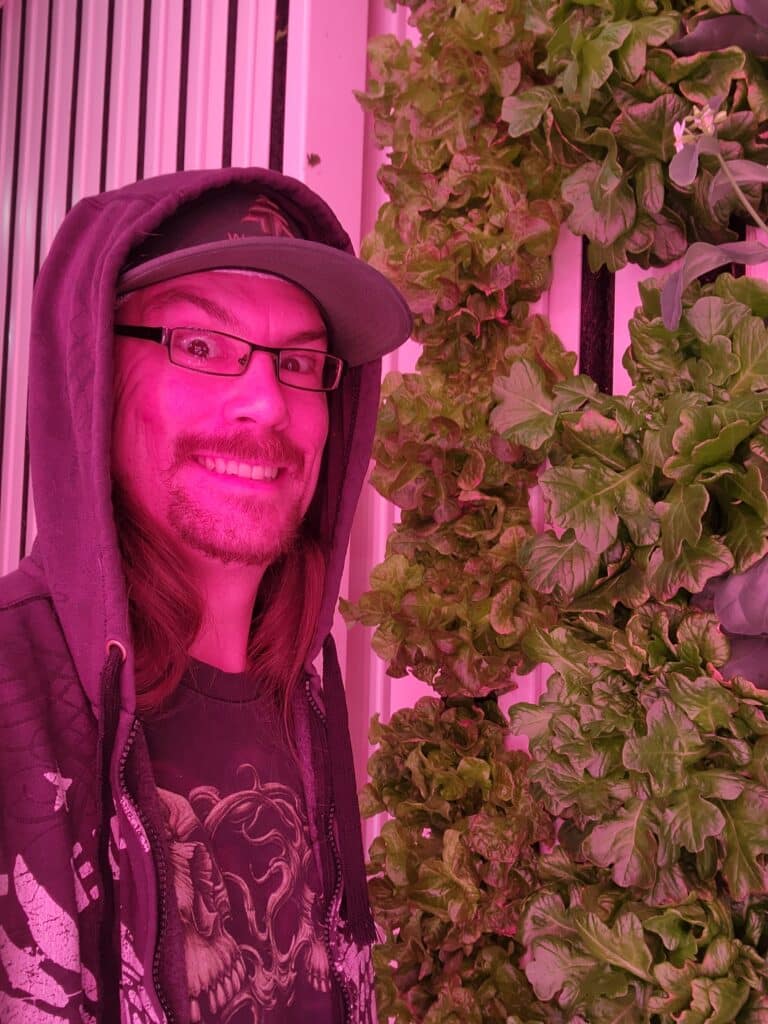 Man smiling with lettuce