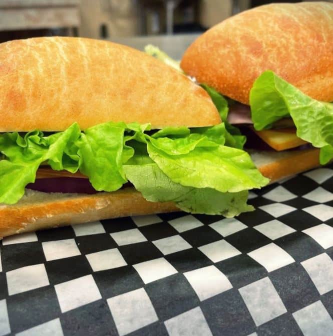 two sandwiches with lettuce
